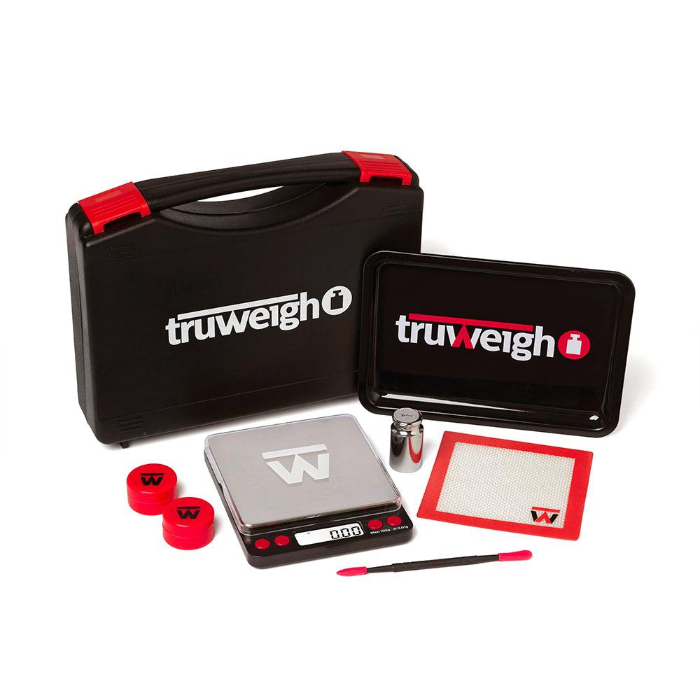 The 710-Pro Concentrate Kit is displayed open, revealing red silicone containers and a black carrying case on a white background. The 710-Pro Concentrate Kit is displayed open, revealing red silicone containers and a black carrying case on a white background.
