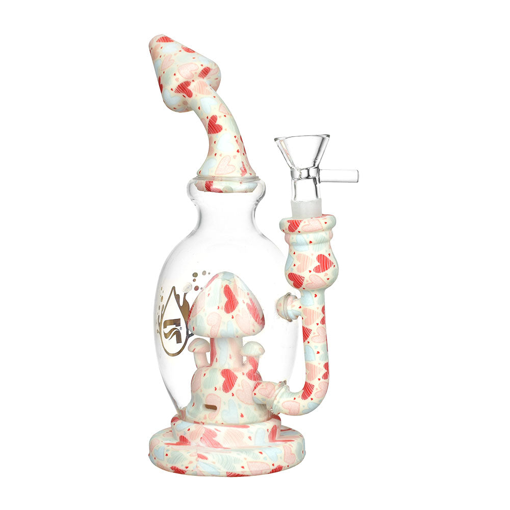 A three-quarter view of the Shroom Celebration Water Pipe, showcasing its mushroom-shaped design in a textured, reddish-white finish. A three-quarter view of the Shroom Celebration Water Pipe, showcasing its mushroom-shaped design in a textured, reddish-white finish.