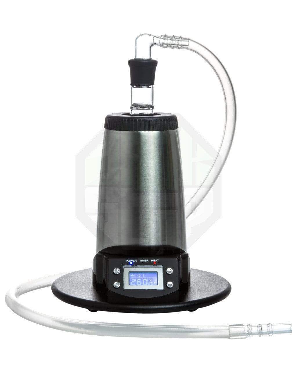 A front view of the V-Tower Vaporizer with a digital display, sitting on a black surface with attached clear tubing. A front view of the V-Tower Vaporizer with a digital display, sitting on a black surface with attached clear tubing.