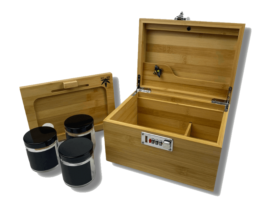 The Bamboo Bzz Box is shown open from a high angle, revealing its wooden interior and displaying two black containers inside. The Bamboo Bzz Box is shown open from a high angle, revealing its wooden interior and displaying two black containers inside.