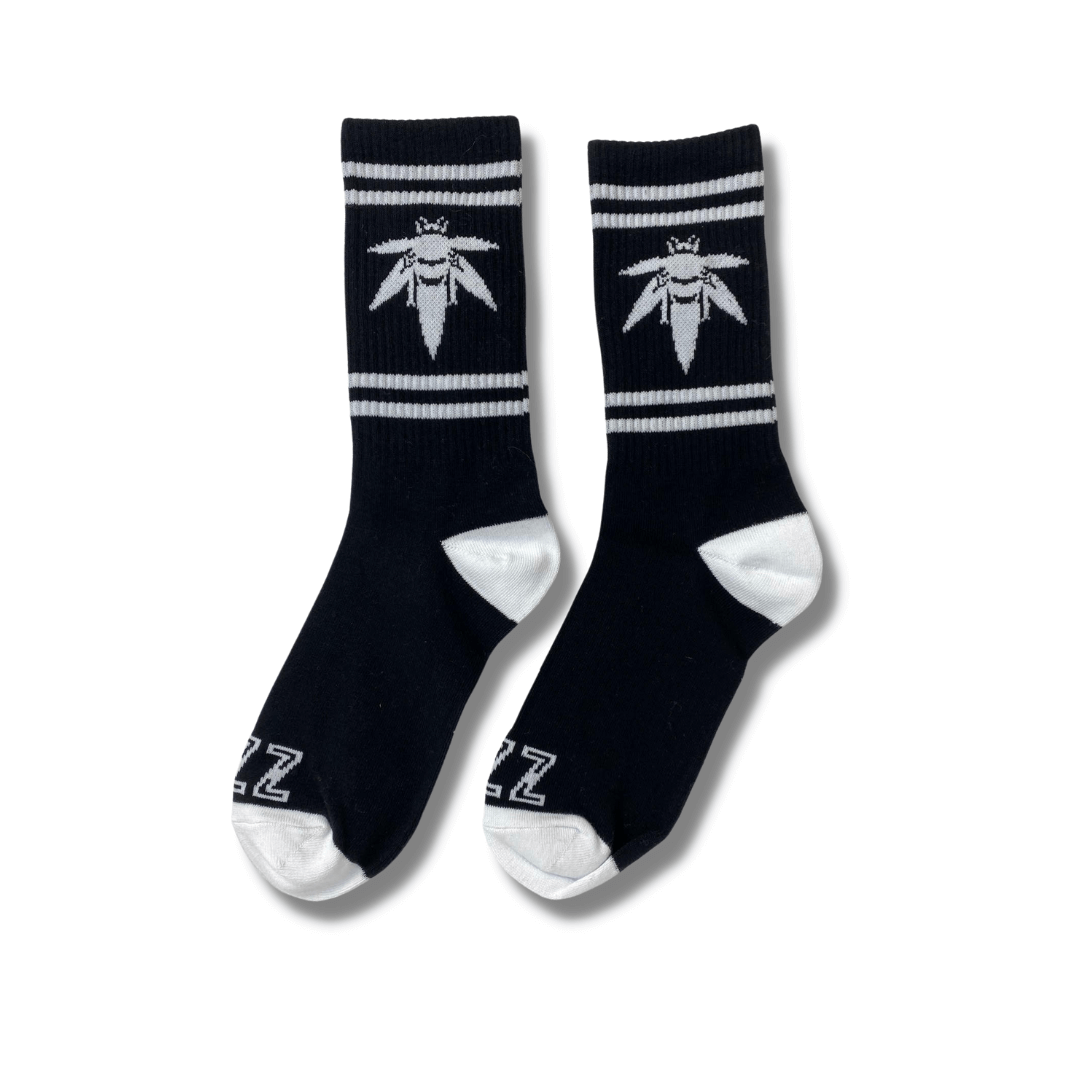 A pair of black Bzz Socks displayed against a plain white background, showing the distinct logo pattern. A pair of black Bzz Socks displayed against a plain white background, showing the distinct logo pattern.