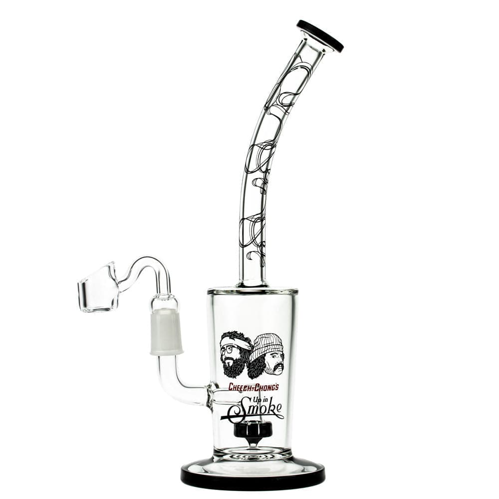 A studio shot of the Maui Wowie 10" Dab Rig, featuring a clear glass body and angled mouthpiece against a plain white background. A studio shot of the Maui Wowie 10" Dab Rig, featuring a clear glass body and angled mouthpiece against a plain white background.