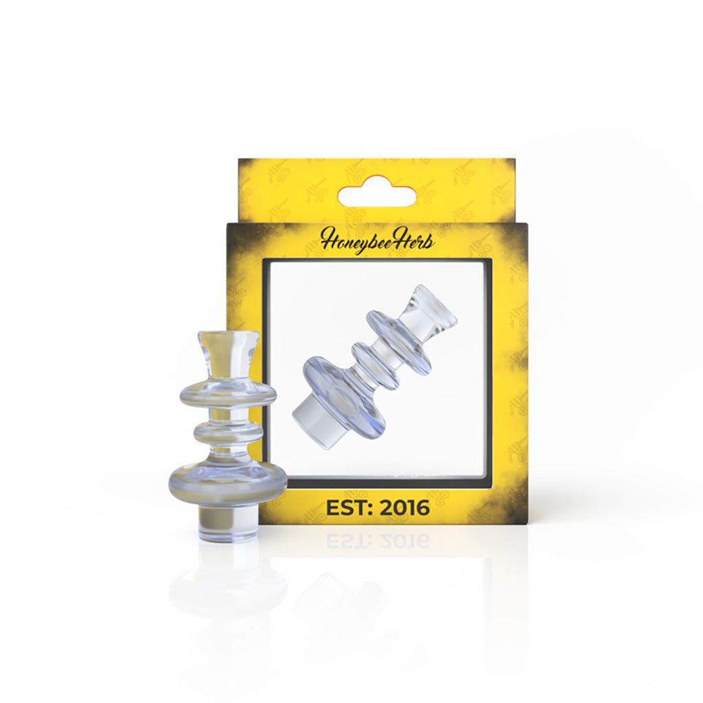 Front view of the Ghost Glass Slurper Cap, a clear glass cap resting on a reflective surface. Front view of the Ghost Glass Slurper Cap, a clear glass cap resting on a reflective surface.