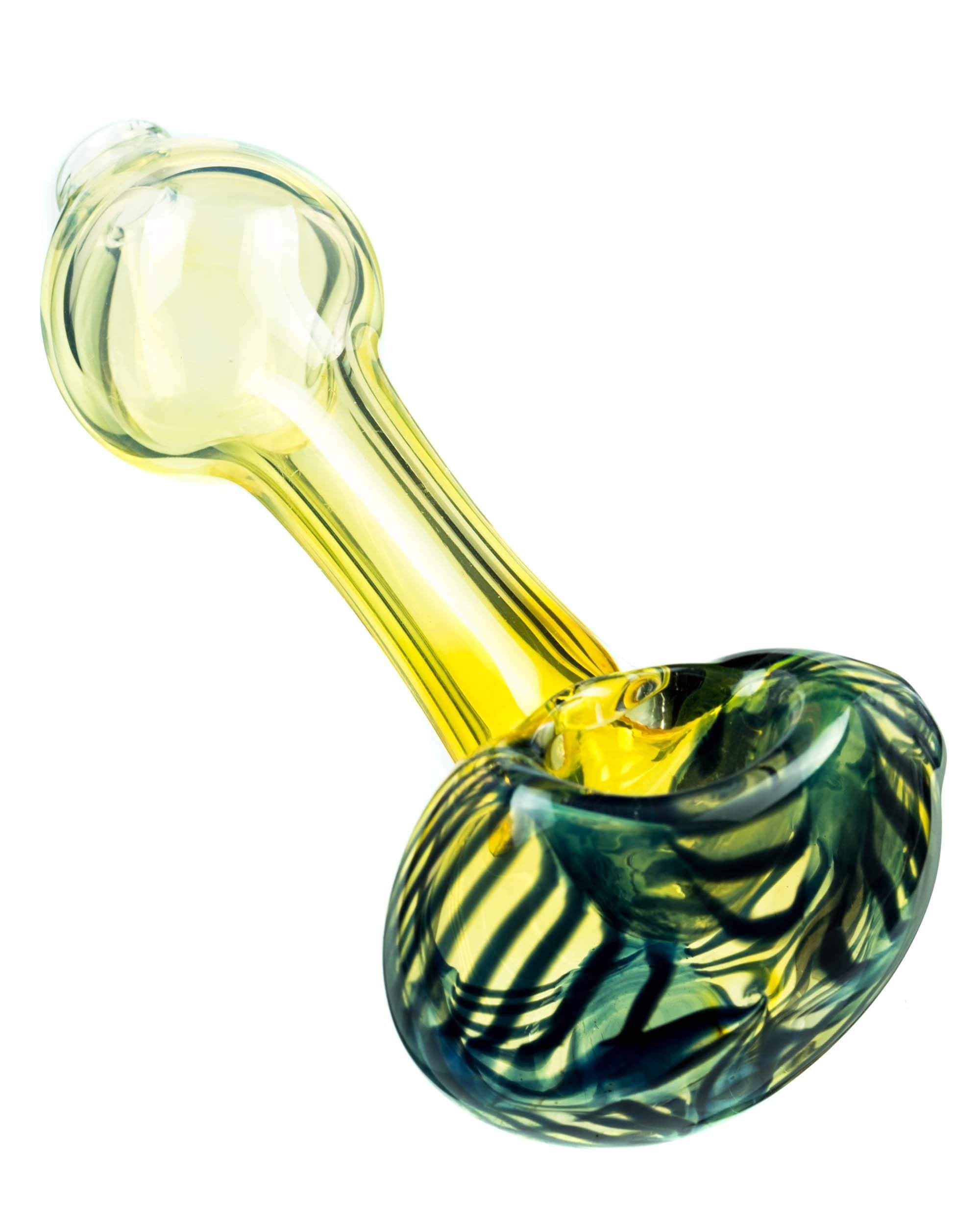 A side view of the Raked Face Fumed Spoon Pipe shows a glass pipe with a raked face design and light fume coloring. A side view of the Raked Face Fumed Spoon Pipe shows a glass pipe with a raked face design and light fume coloring.