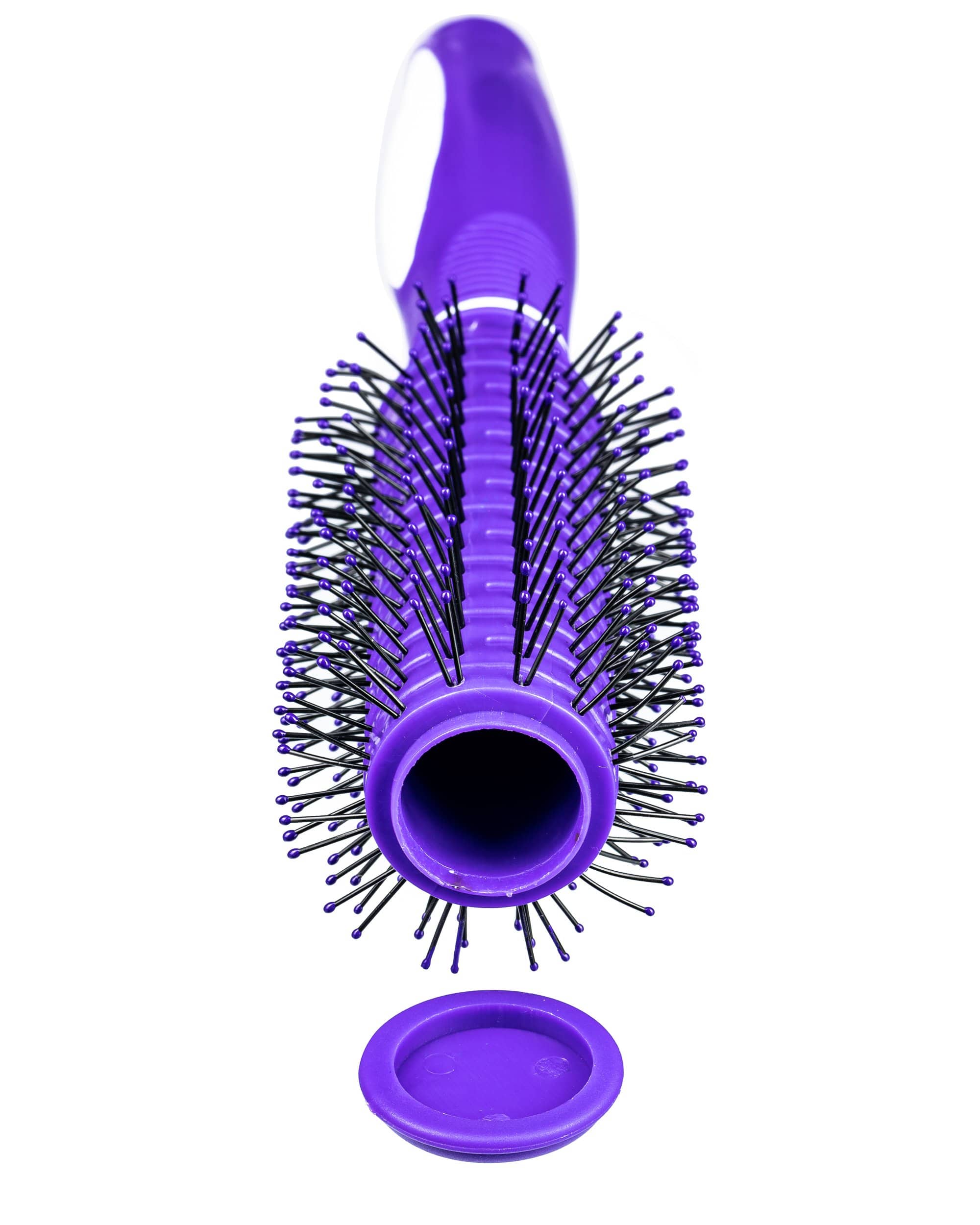 Overhead view of the Secret Stash Hair Brush, revealing a hollowed-out chamber within the handle and a full brush of black bristles. Overhead view of the Secret Stash Hair Brush, revealing a hollowed-out chamber within the handle and a full brush of black bristles.
