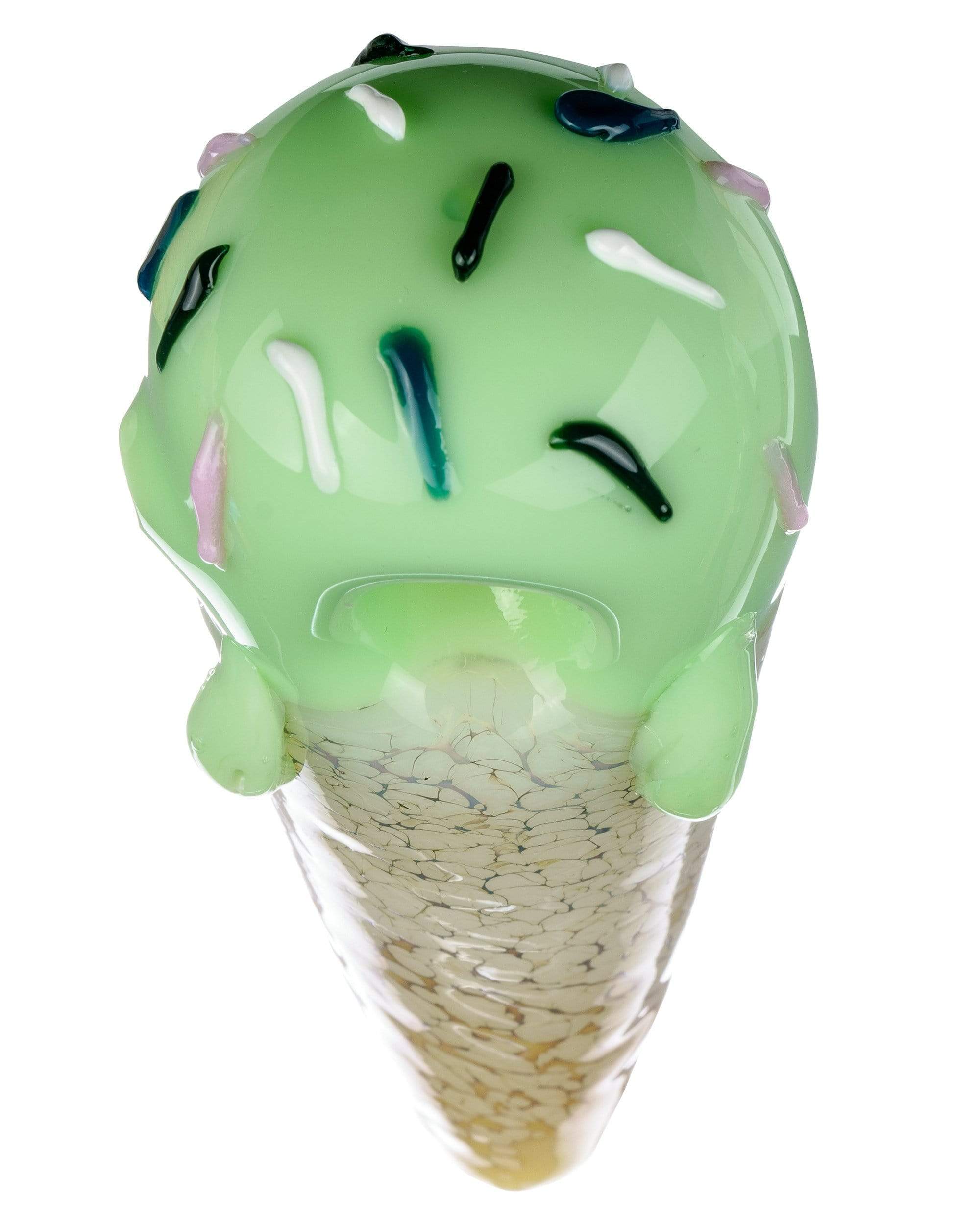 A close-up, angled view of the Single Scoop Ice Cream Spoon Pipe, showing the curved, green glass design. A close-up, angled view of the Single Scoop Ice Cream Spoon Pipe, showing the curved, green glass design.