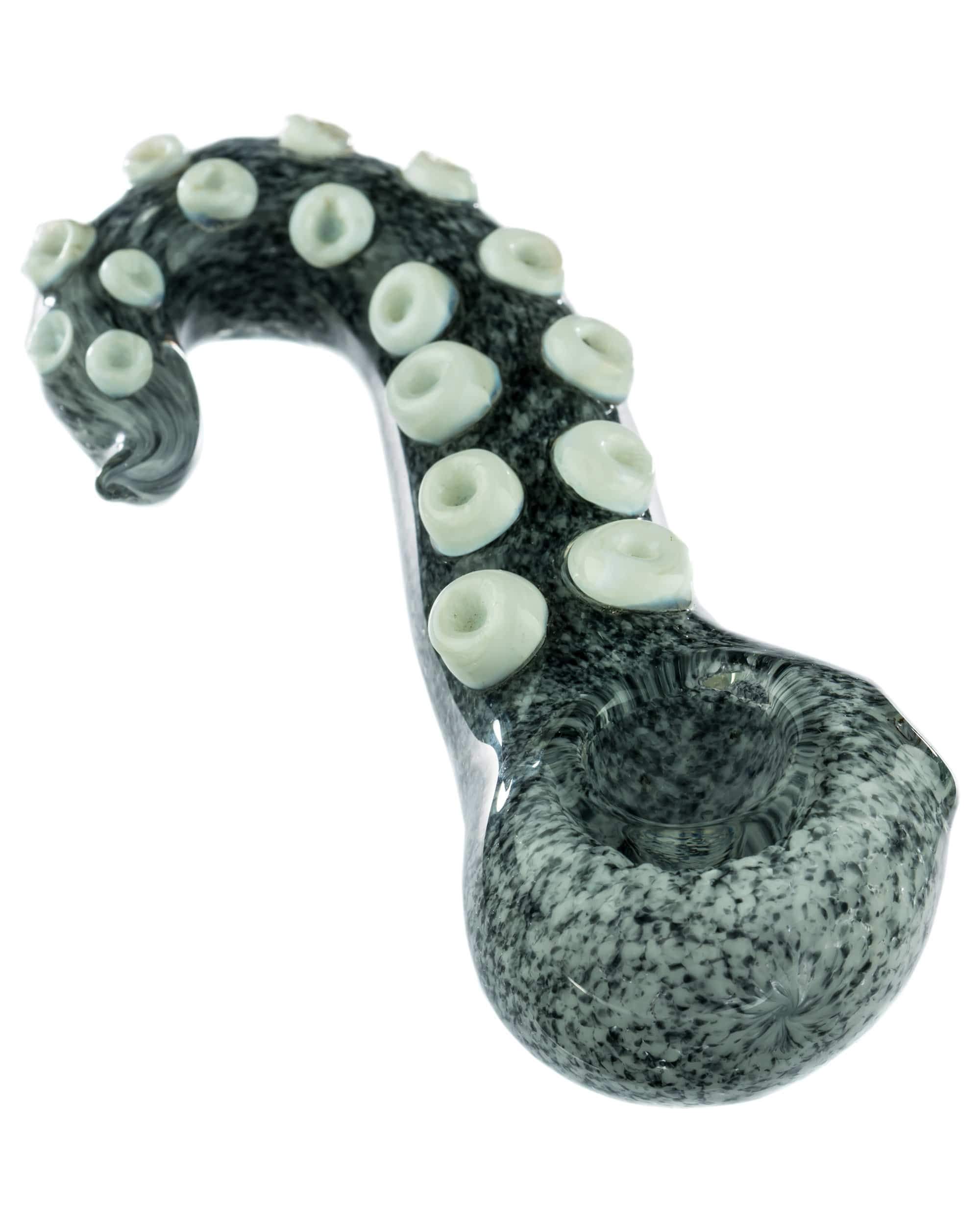 A side view of the Tentacle Spoon Pipe, showcasing its sculpted, textured design in a dark, translucent material. A side view of the Tentacle Spoon Pipe, showcasing its sculpted, textured design in a dark, translucent material.