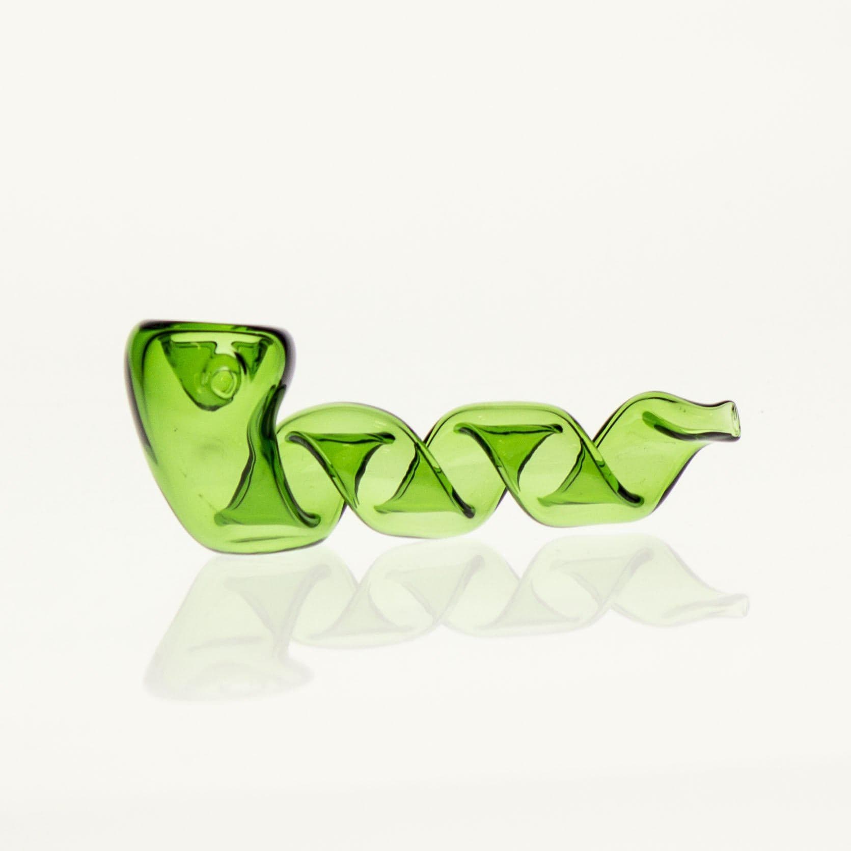 A close-up, angled view of the Twisted Pipe, showcasing its curved, green glass design against a reflective surface. A close-up, angled view of the Twisted Pipe, showcasing its curved, green glass design against a reflective surface.
