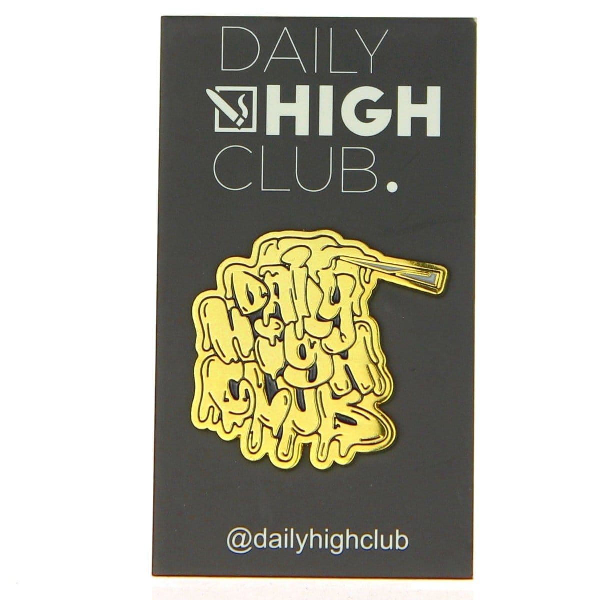 The Daily High Club Dab Slab Enamel Pin is displayed as a close-up shot against a dark background. The Daily High Club Dab Slab Enamel Pin is displayed as a close-up shot against a dark background.