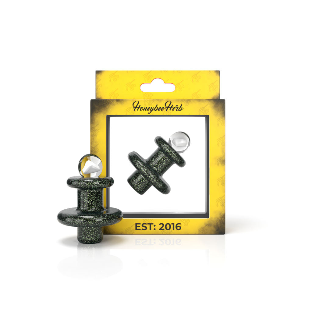 A close-up studio shot of the Opal Galaxy Terp Slurper Cap, displaying its sleek, dark design against a white backdrop. A close-up studio shot of the Opal Galaxy Terp Slurper Cap, displaying its sleek, dark design against a white backdrop.