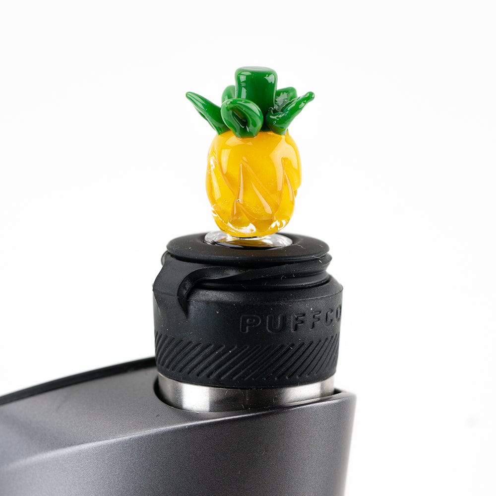 Close-up of the Pineapple Puffco Peak Pro Carb Cap, showcasing its textured, translucent design against a dark backdrop. Close-up of the Pineapple Puffco Peak Pro Carb Cap, showcasing its textured, translucent design against a dark backdrop.