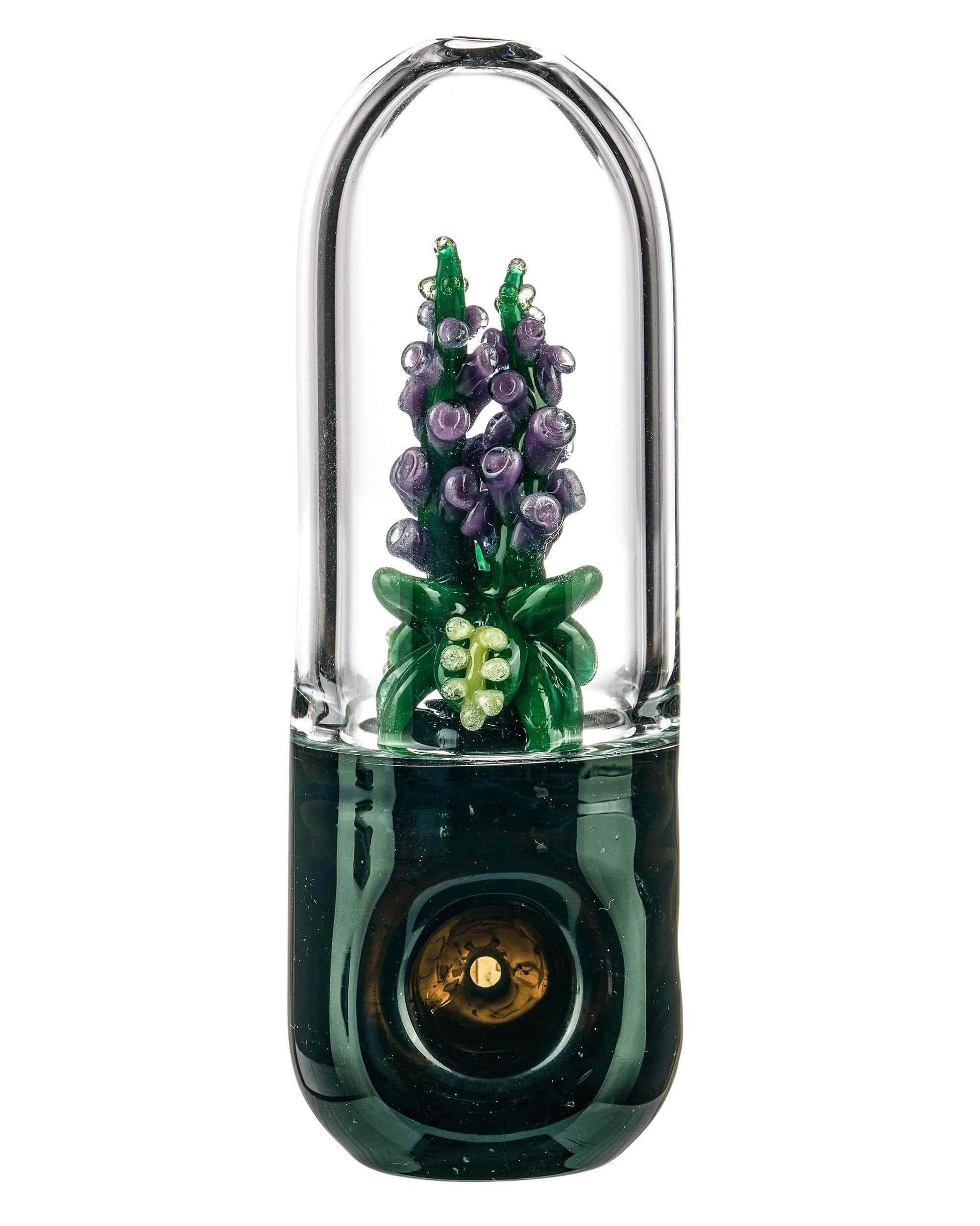 A close-up, angled view of the Foxglove Flower Hand Pipe, showcasing its floral design in shades of purple and green. A close-up, angled view of the Foxglove Flower Hand Pipe, showcasing its floral design in shades of purple and green.