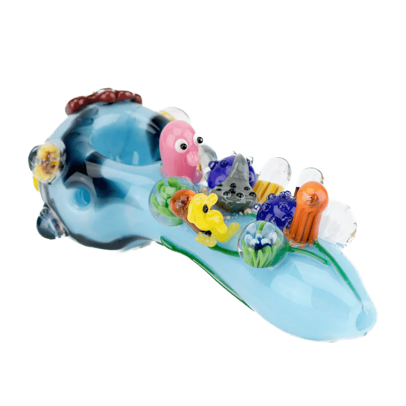 A side view of the Great Barrier Reef Spoon Pipe shows a colorful, sculpted glass pipe resembling a coral reef. A side view of the Great Barrier Reef Spoon Pipe shows a colorful, sculpted glass pipe resembling a coral reef.