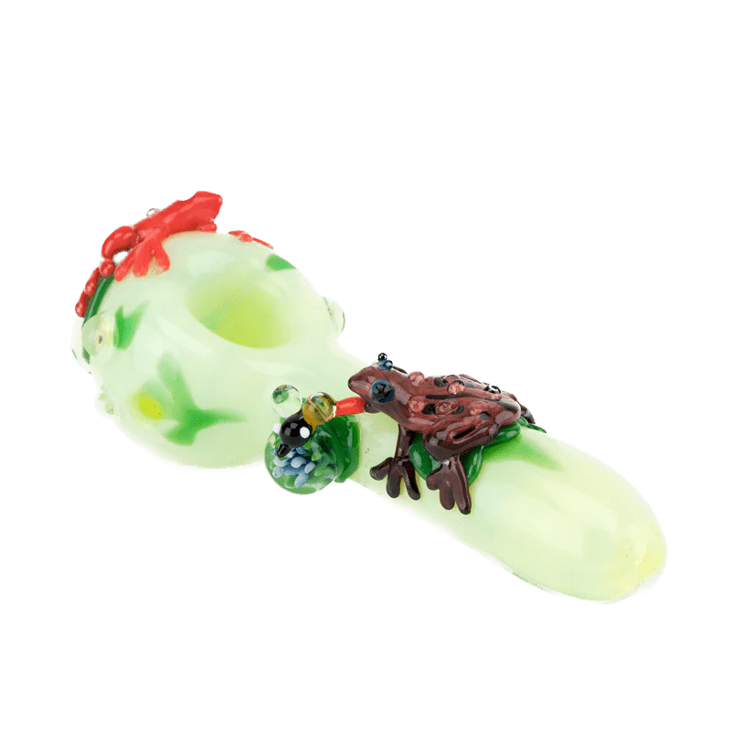 A close-up of the Ribbit Spoon Pipe, showing its curved shape and textured, green glass construction. A close-up of the Ribbit Spoon Pipe, showing its curved shape and textured, green glass construction.