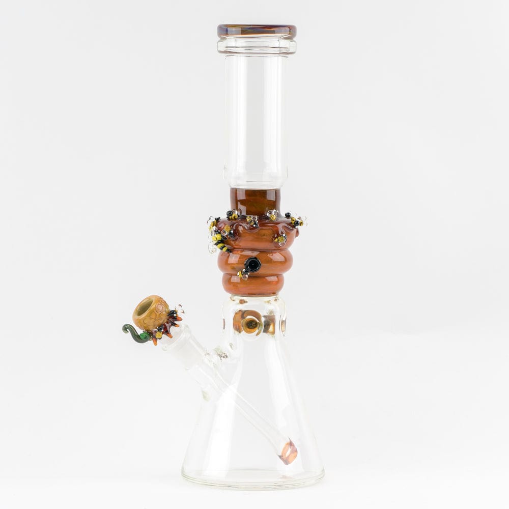 Front view of the Save the Bees Beaker, a clear glass piece with bee-themed accents around the neck. Front view of the Save the Bees Beaker, a clear glass piece with bee-themed accents around the neck.