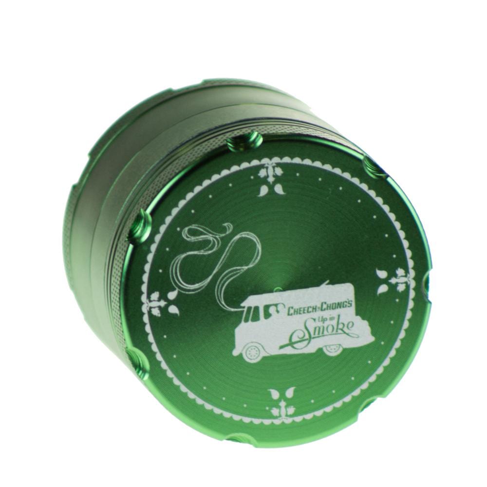 A top-down view of the Famous X Up In Smoke 50mm 4-Piece Grinder, showcasing its metallic, circular design with visible inner compartments. A top-down view of the Famous X Up In Smoke 50mm 4-Piece Grinder, showcasing its metallic, circular design with visible inner compartments.