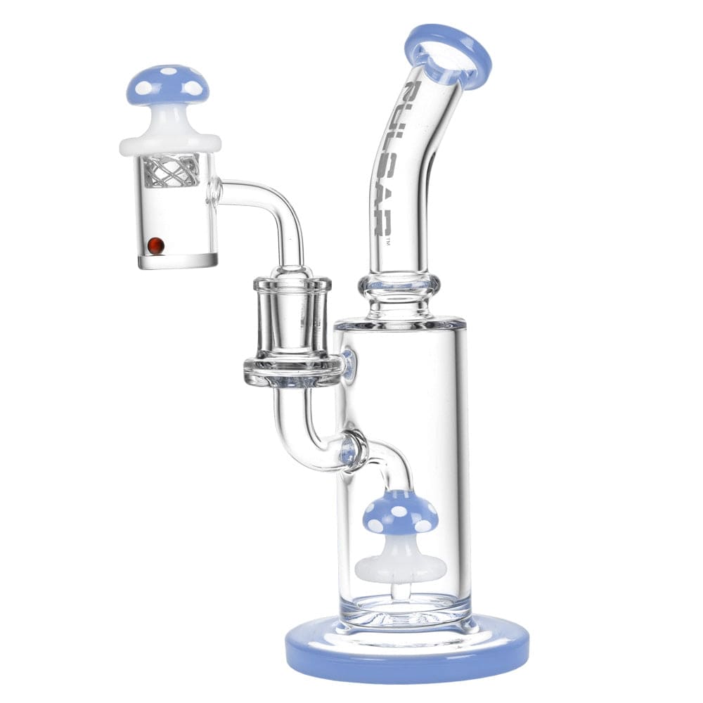 Front view of the Shroom Rig Set w/ Carb Cap, showing a clear glass rig with a blue base and carb cap attached. Front view of the Shroom Rig Set w/ Carb Cap, showing a clear glass rig with a blue base and carb cap attached.