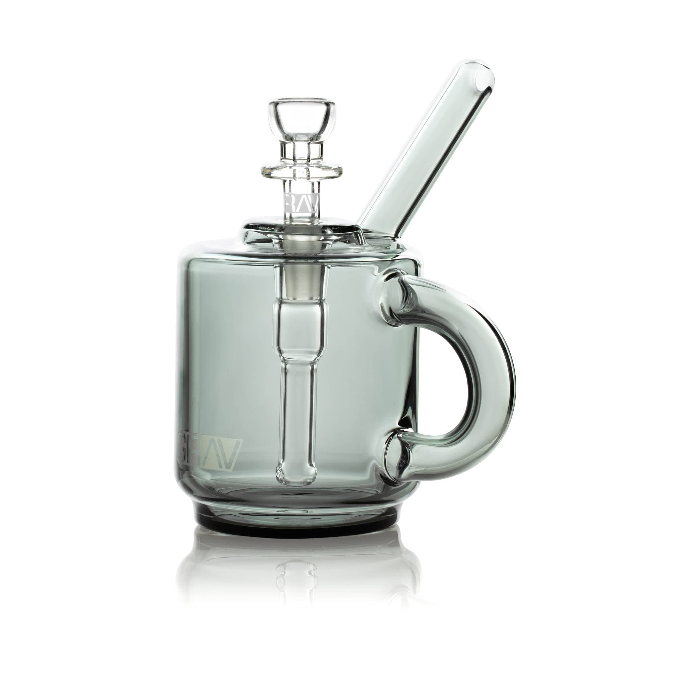 A side view of the Coffee Mug Pocket Bubbler, showcasing its clear glass construction and unique mug-like form. A side view of the Coffee Mug Pocket Bubbler, showcasing its clear glass construction and unique mug-like form.