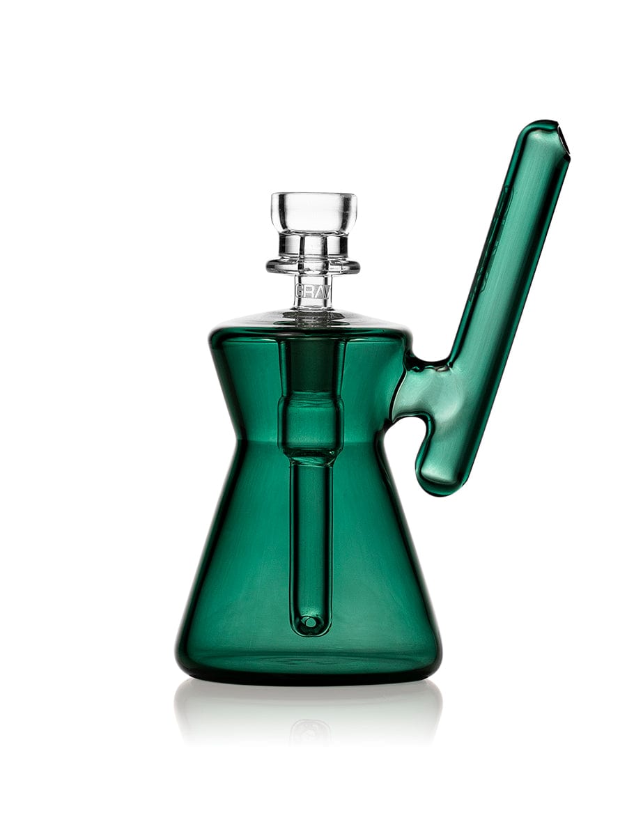 Hourglass Pocket Bubbler, a side view of the green glass bubbler with a simple, curved mouthpiece. Hourglass Pocket Bubbler, a side view of the green glass bubbler with a simple, curved mouthpiece.