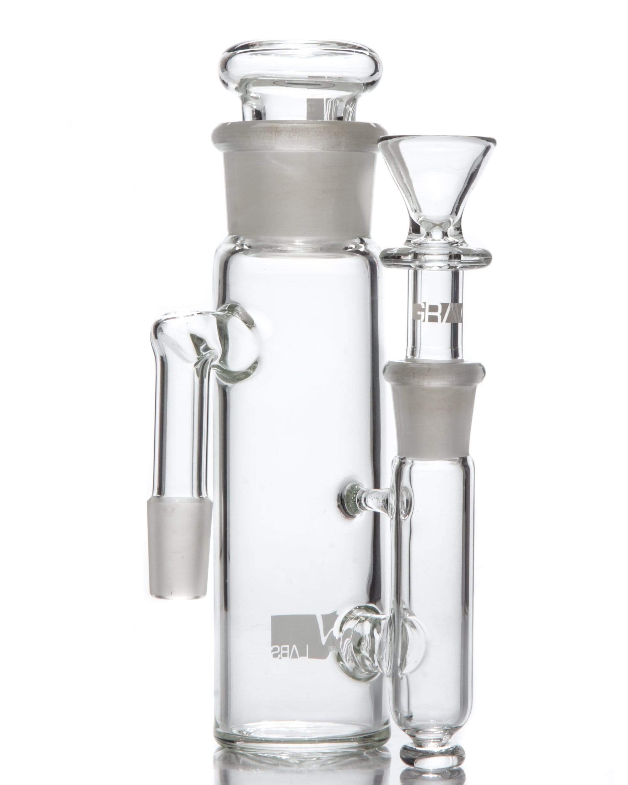 A studio shot shows the 90˚ "Phoenix" Ashcatcher with a removable top, its clear glass reflecting off the dark surface it rests on. A studio shot shows the 90˚ "Phoenix" Ashcatcher with a removable top, its clear glass reflecting off the dark surface it rests on.