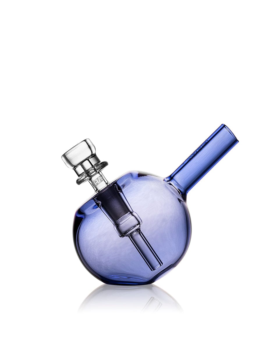A three-quarter view of the Spherical Pocket Bubbler, showcasing its rounded form and clear glass construction against a white backdrop. A three-quarter view of the Spherical Pocket Bubbler, showcasing its rounded form and clear glass construction against a white backdrop.