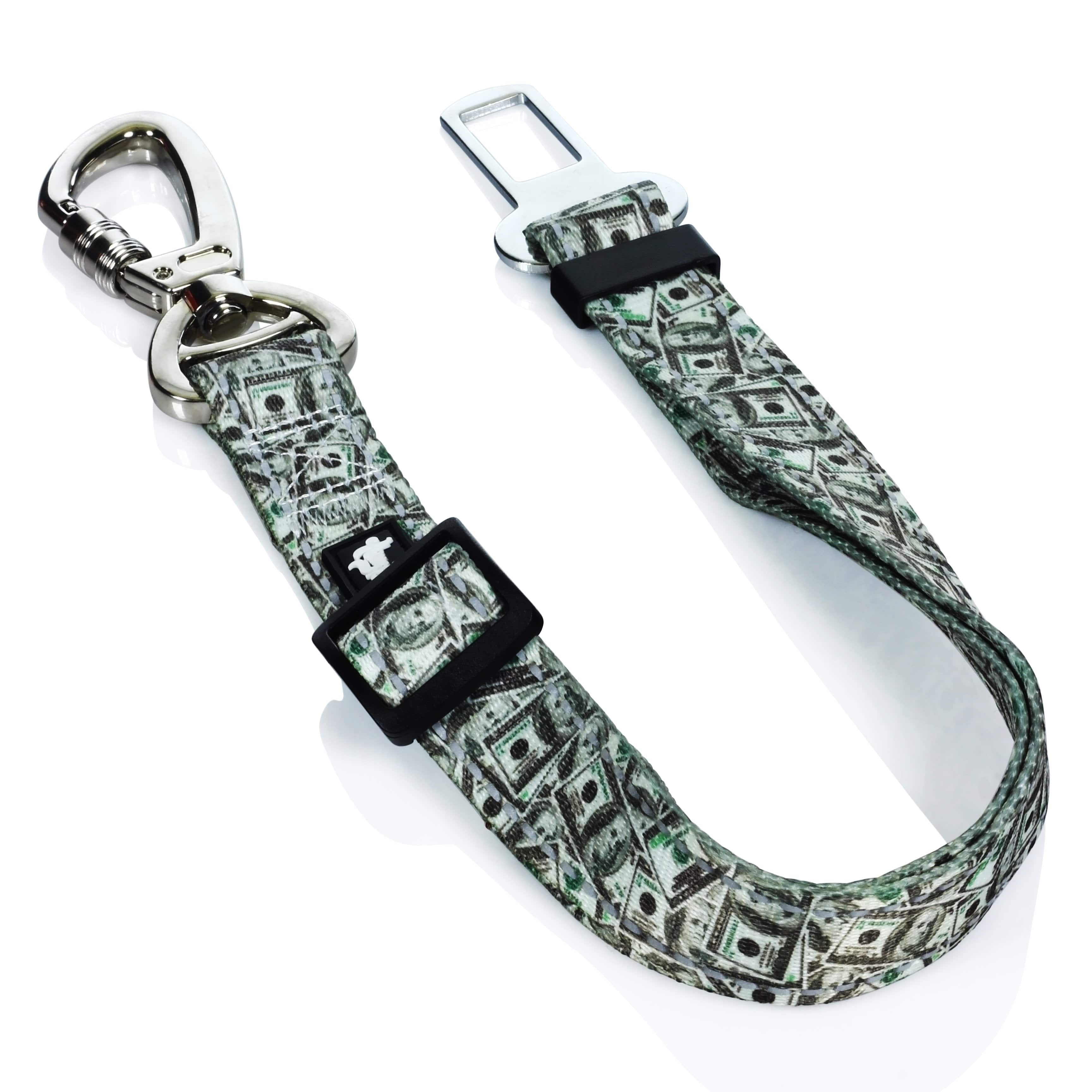 The Pet Seat Belt is shown in a close-up, angled view, featuring a patterned strap and metal buckle. The Pet Seat Belt is shown in a close-up, angled view, featuring a patterned strap and metal buckle.