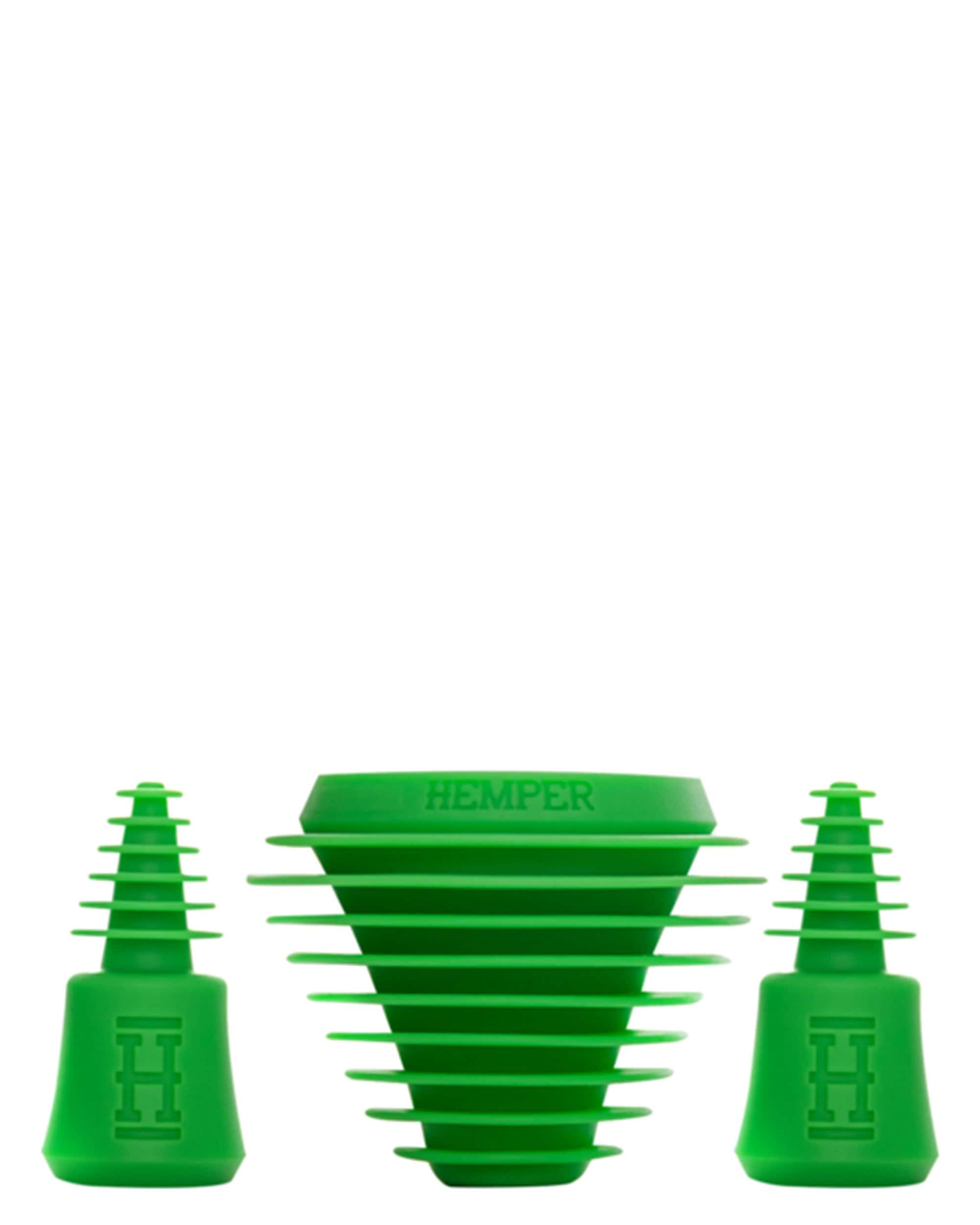 A close-up, angled view of the Cleaning Plugs and Caps, showing two green rubber stoppers against a plain white background. A close-up, angled view of the Cleaning Plugs and Caps, showing two green rubber stoppers against a plain white background.