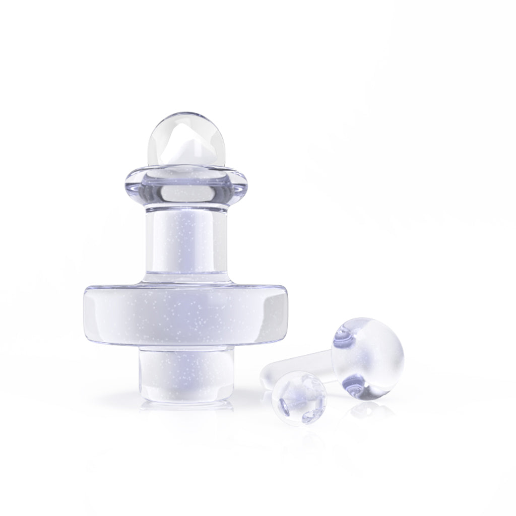 A slightly angled, close-up view of the Opal Ghost Glass Terp Slurper Set, showcasing the clear glass construction and smooth, rounded design. A slightly angled, close-up view of the Opal Ghost Glass Terp Slurper Set, showcasing the clear glass construction and smooth, rounded design.