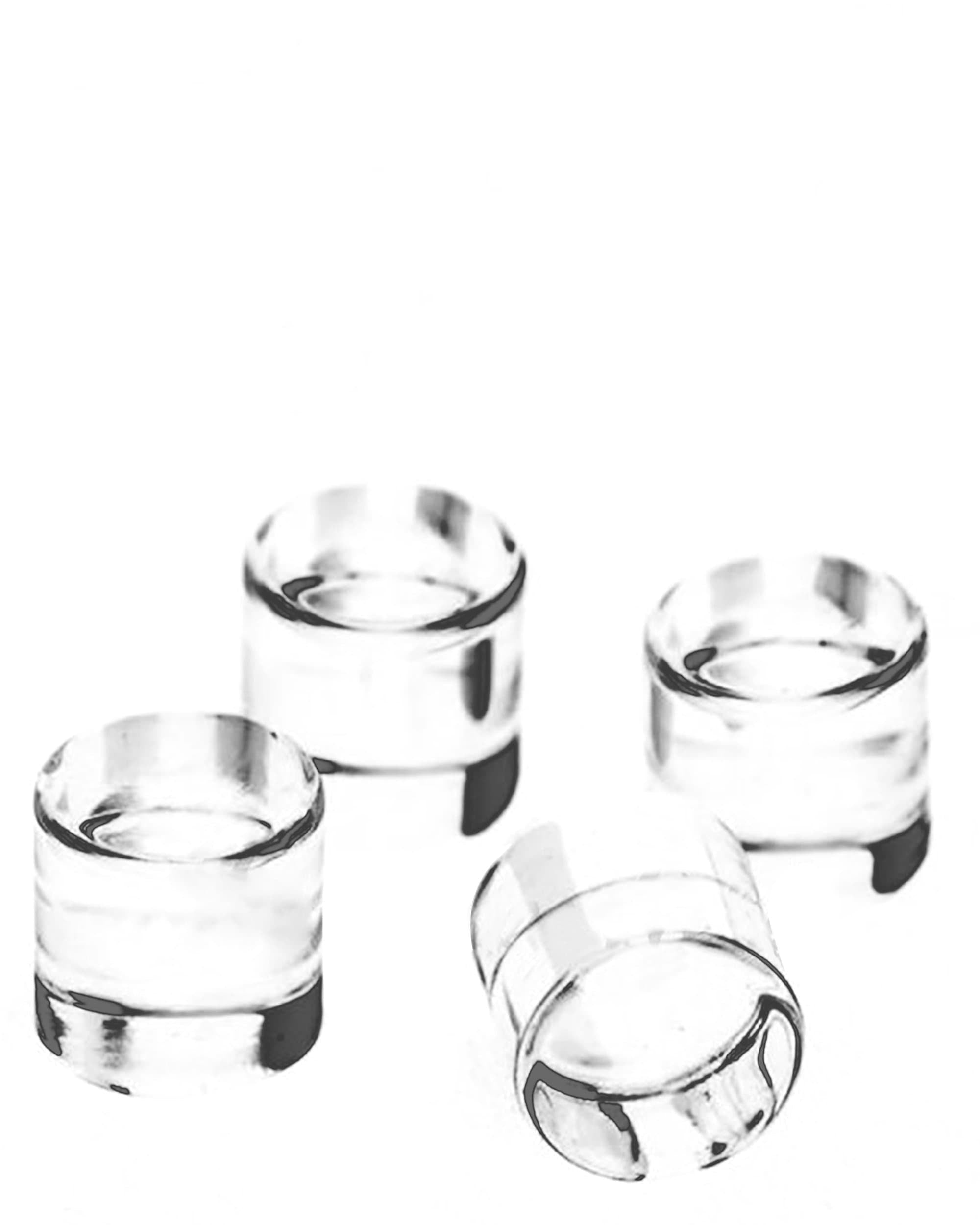 A slightly angled close-up of the Quad Cores, showcasing their clear glass construction and simple cylindrical form. A slightly angled close-up of the Quad Cores, showcasing their clear glass construction and simple cylindrical form.