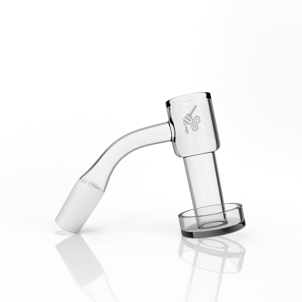 A close-up, angled view of the Honeysuckle Bevel Quartz Banger with a yellow line, reflecting on a polished surface. A close-up, angled view of the Honeysuckle Bevel Quartz Banger with a yellow line, reflecting on a polished surface.