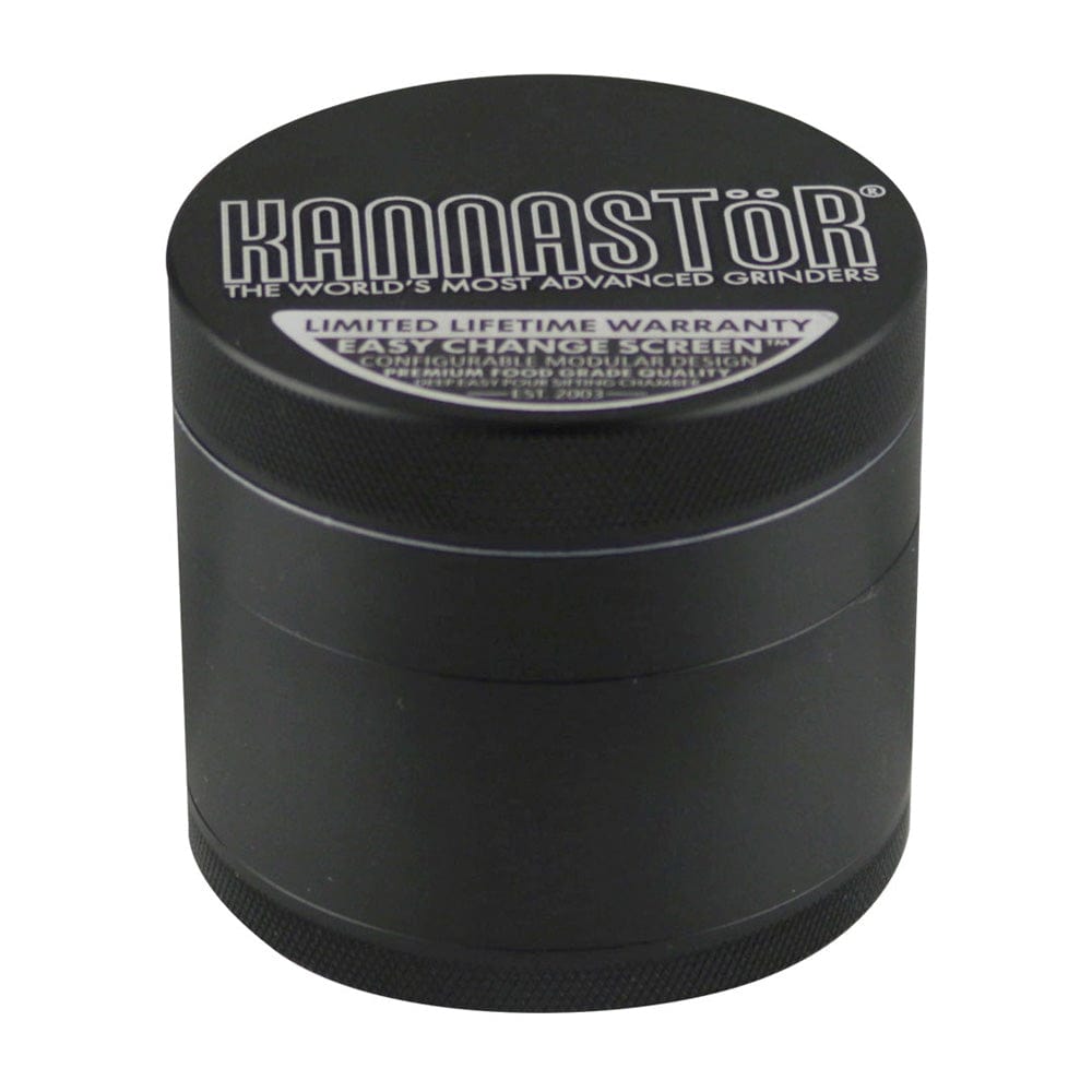 A close-up, angled view of the Multi Chamber 4pc Grinder, showcasing its dark finish and branded logo. A close-up, angled view of the Multi Chamber 4pc Grinder, showcasing its dark finish and branded logo.