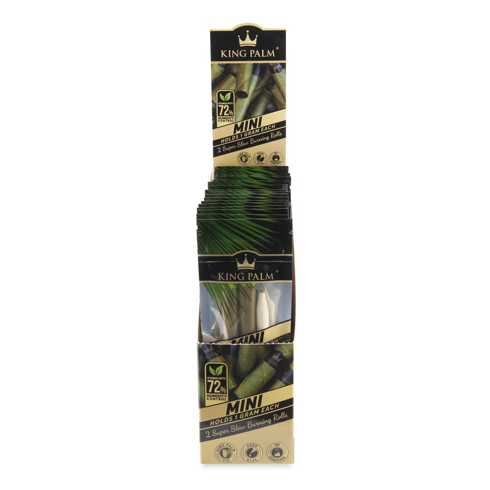 Front view of the King Palm Mini Pre Rolled Cones packaging, showcasing a stack of 20 packs against a dark background. Front view of the King Palm Mini Pre Rolled Cones packaging, showcasing a stack of 20 packs against a dark background.