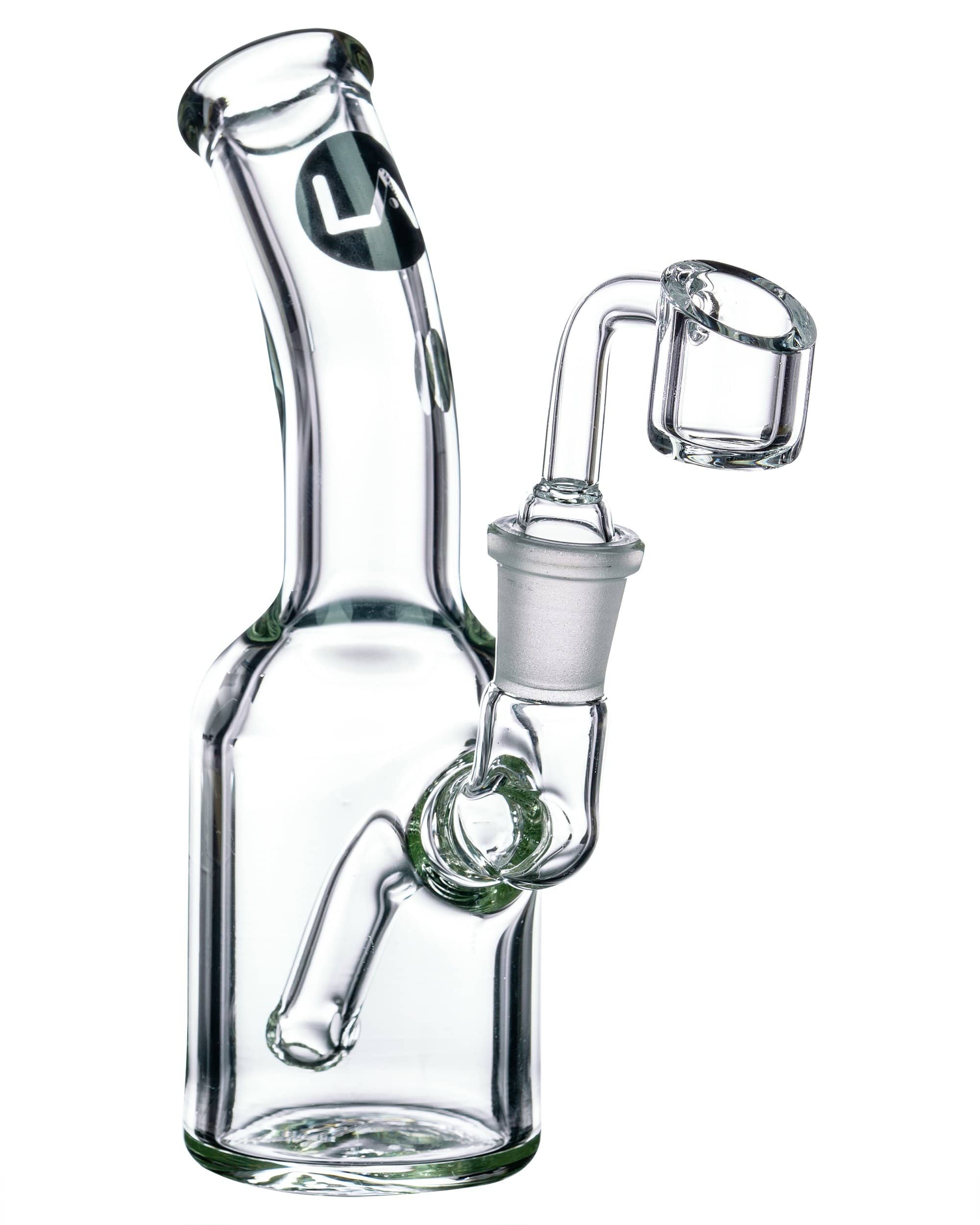A three-quarter view of the Heavy Mini Can Dab Rig, showing the clear glass and compact size against a white background. A three-quarter view of the Heavy Mini Can Dab Rig, showing the clear glass and compact size against a white background.