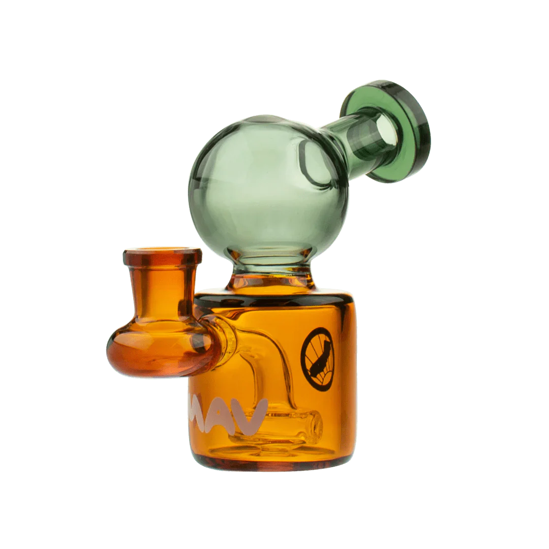 A close-up, angled view of the Mini Squig Rig, showcasing its compact size and glass construction. A close-up, angled view of the Mini Squig Rig, showcasing its compact size and glass construction.