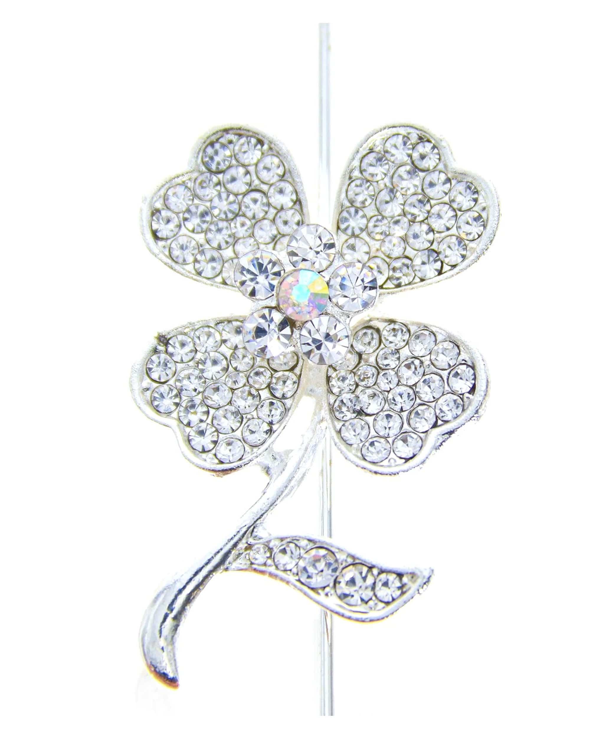 A detailed close-up of the Aubrey Hepburn Joint Clip Poker, showing a silver metal clip with a sleek, curved design. A detailed close-up of the Aubrey Hepburn Joint Clip Poker, showing a silver metal clip with a sleek, curved design.