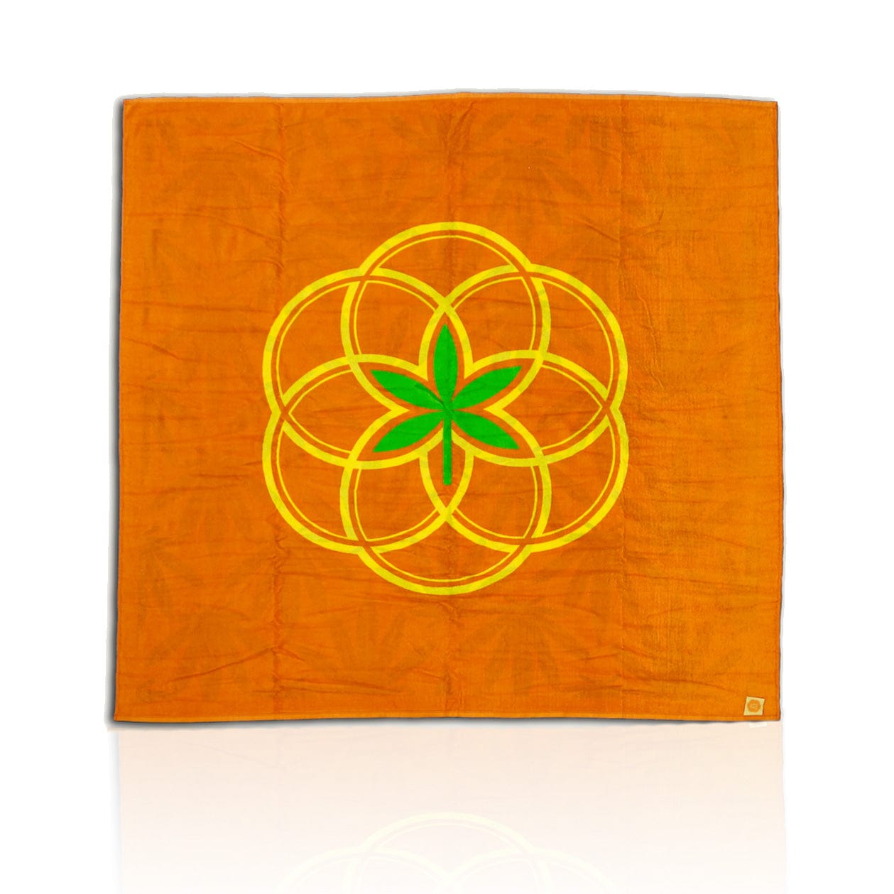A top-down view of the BIG Beach Towel, showcasing a vibrant, patterned orange and white design with a circular motif. A top-down view of the BIG Beach Towel, showcasing a vibrant, patterned orange and white design with a circular motif.