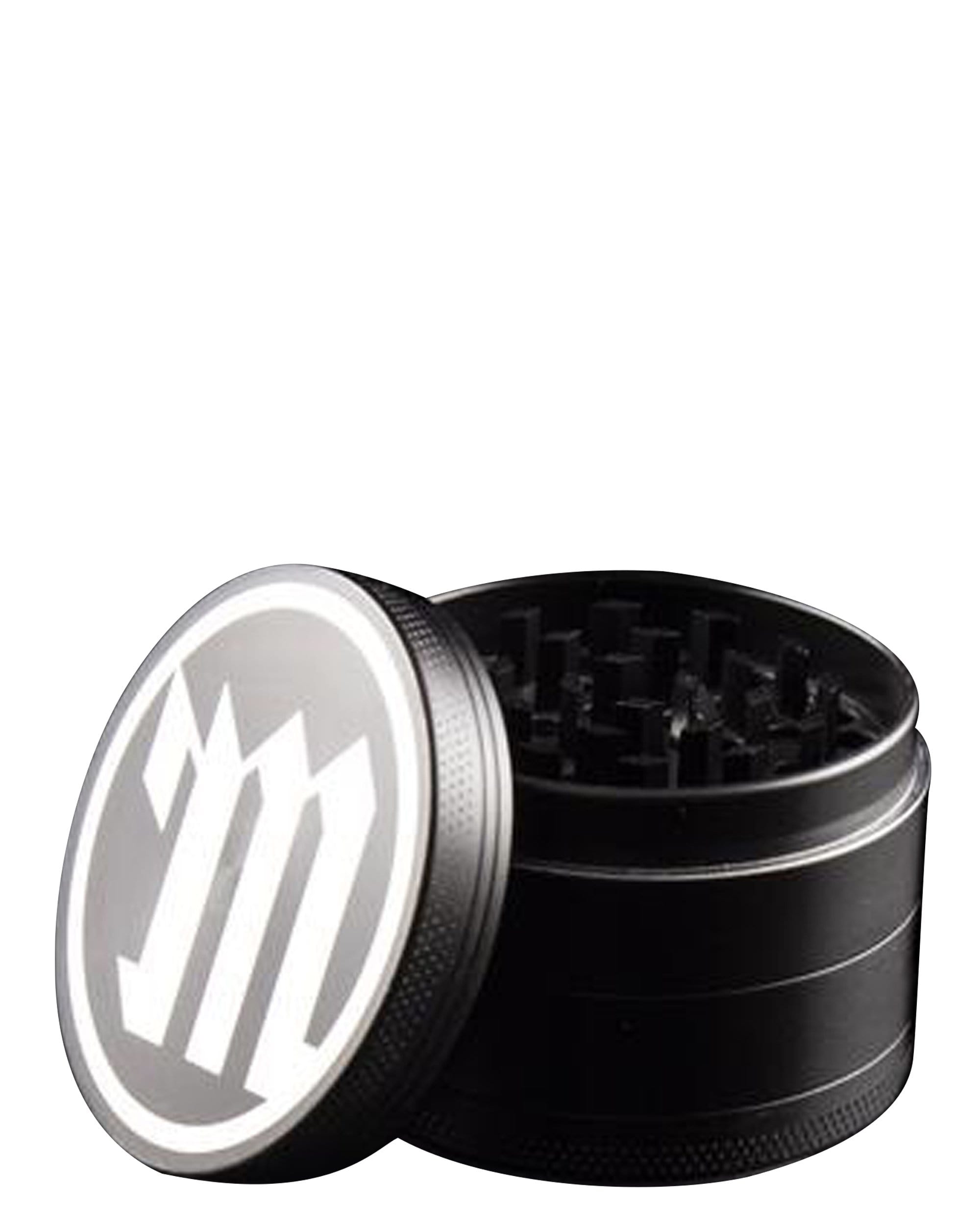A close-up, angled view of the Four Piece Herb Grinder, showcasing its open, multi-tiered metal construction. A close-up, angled view of the Four Piece Herb Grinder, showcasing its open, multi-tiered metal construction.