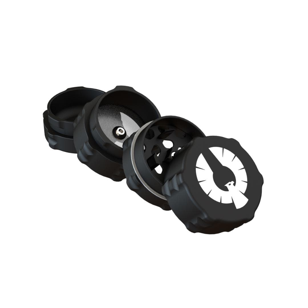 A close-up view of the 4 Piece Small Grinder, displaying its multi-tiered metallic design against a neutral backdrop. A close-up view of the 4 Piece Small Grinder, displaying its multi-tiered metallic design against a neutral backdrop.