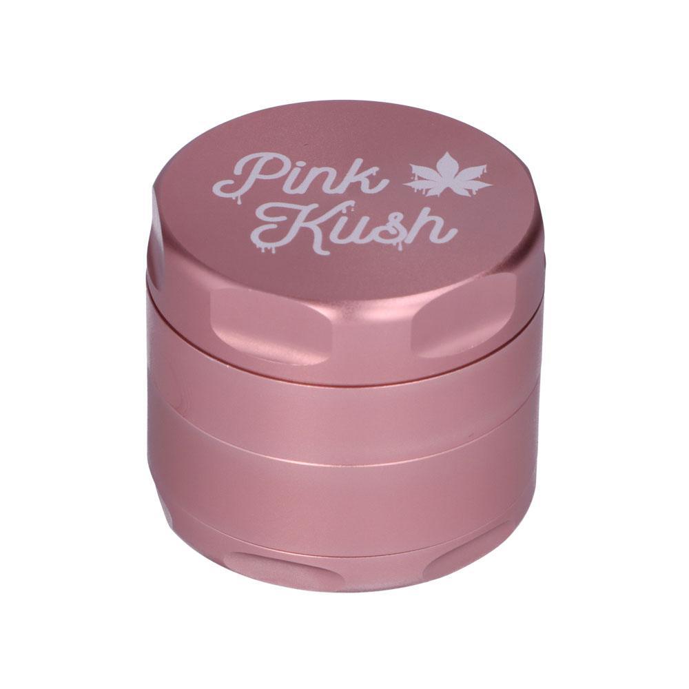 Close-up of the Pink Kush 55mm 3-Stage Grinder, showing a metallic, cylindrical shape against a plain white background. Close-up of the Pink Kush 55mm 3-Stage Grinder, showing a metallic, cylindrical shape against a plain white background.