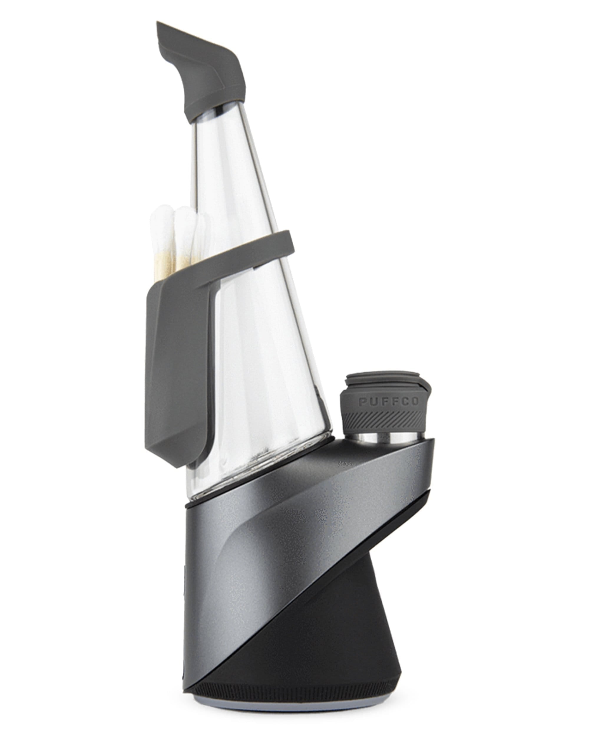 A close-up, angled view of the Puffco Peak Pro Travel Pack, showcasing the sleek, dark glass accessory. A close-up, angled view of the Puffco Peak Pro Travel Pack, showcasing the sleek, dark glass accessory.