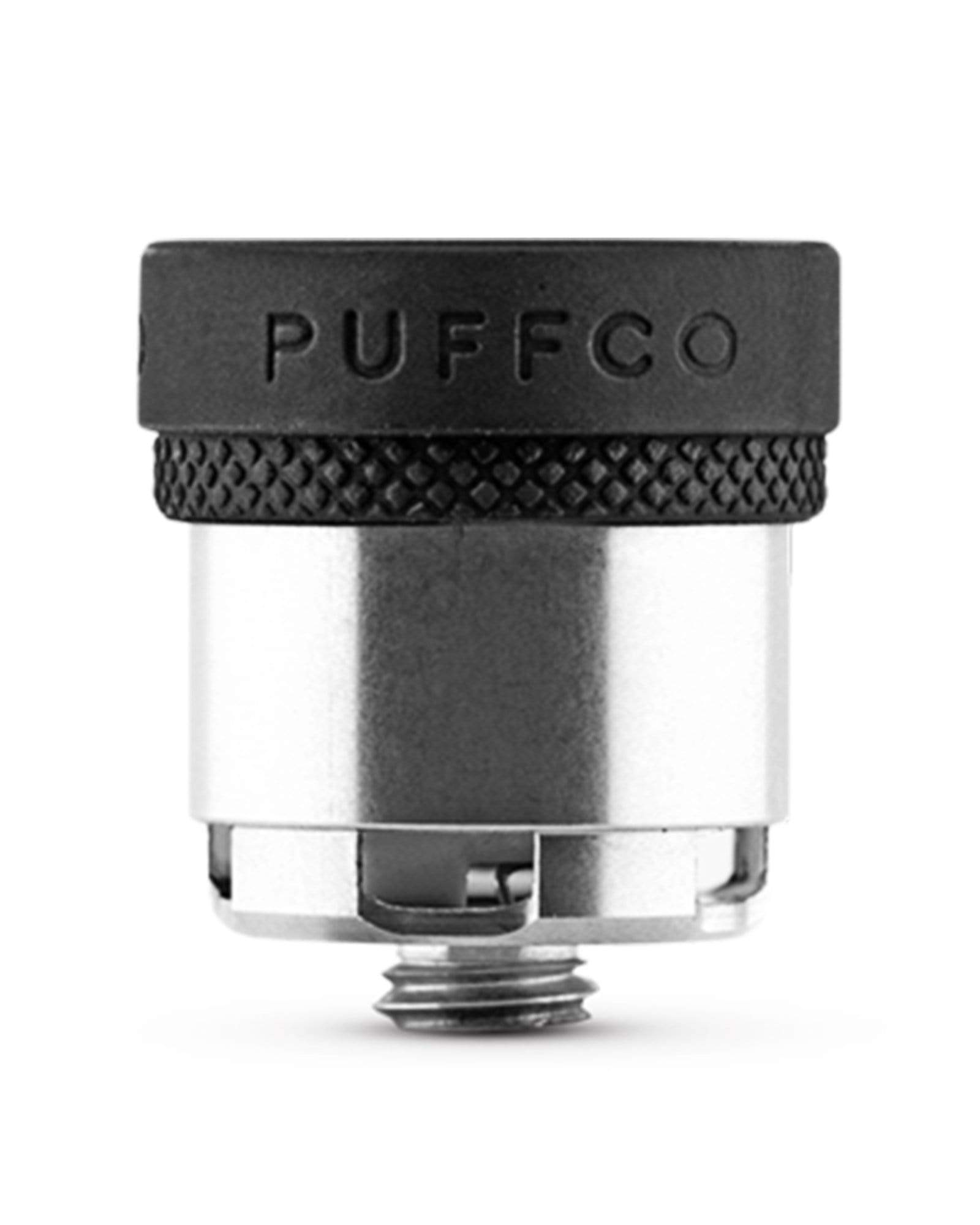 Close-up of the Peak Atomizer, displaying its metallic threading and clear glass reservoir in a studio lighting setup. Close-up of the Peak Atomizer, displaying its metallic threading and clear glass reservoir in a studio lighting setup.