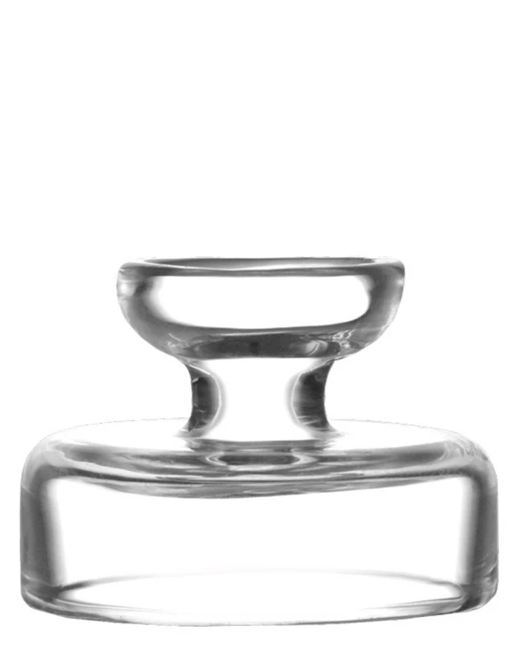 A top-down view of the RöK Replacement Carb Caps, showcasing the clear glass cap's simple, rounded design. A top-down view of the RöK Replacement Carb Caps, showcasing the clear glass cap's simple, rounded design.