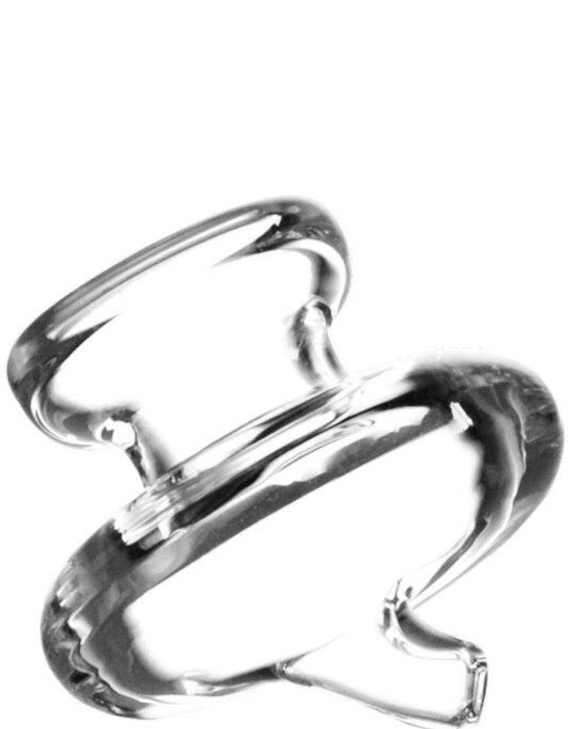 A close-up, angled view of the RöK Replacement Carb Caps, showcasing its smooth, clear glass construction. A close-up, angled view of the RöK Replacement Carb Caps, showcasing its smooth, clear glass construction.