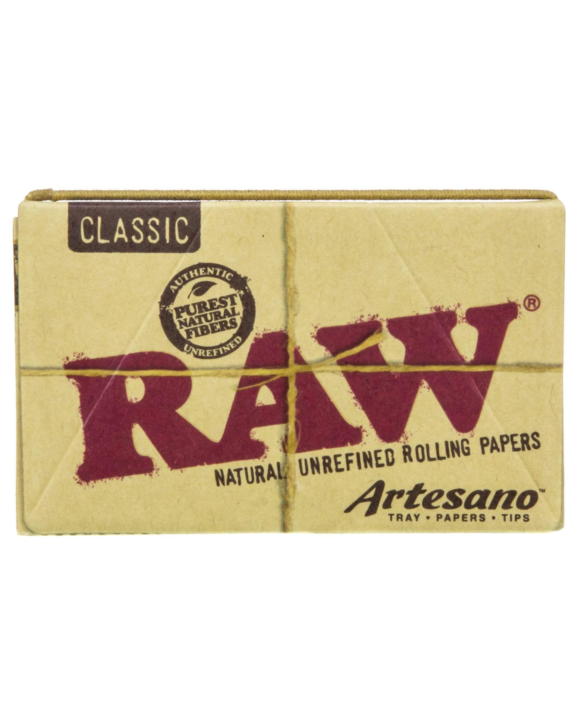A close-up of the Artesano King Size Slim Rolling Papers + Tips packaging, displaying the brand logo and product name against a neutral background. A close-up of the Artesano King Size Slim Rolling Papers + Tips packaging, displaying the brand logo and product name against a neutral background.