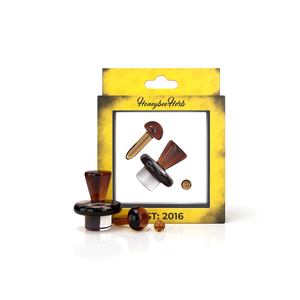 A close-up shot of the Pristine Terp Slurper Set, featuring a clear glass piece with a rounded tip on a dark surface. A close-up shot of the Pristine Terp Slurper Set, featuring a clear glass piece with a rounded tip on a dark surface.