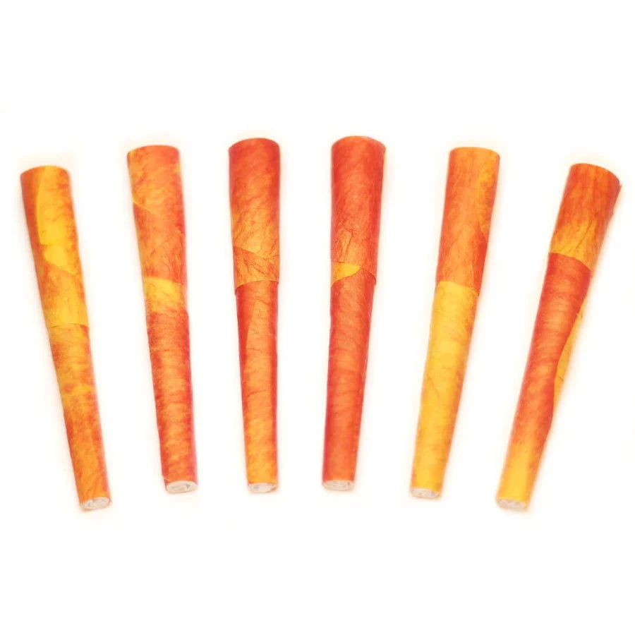 A close-up shows several Mini Rose Petal Cones arranged vertically against a plain white background. A close-up shows several Mini Rose Petal Cones arranged vertically against a plain white background.