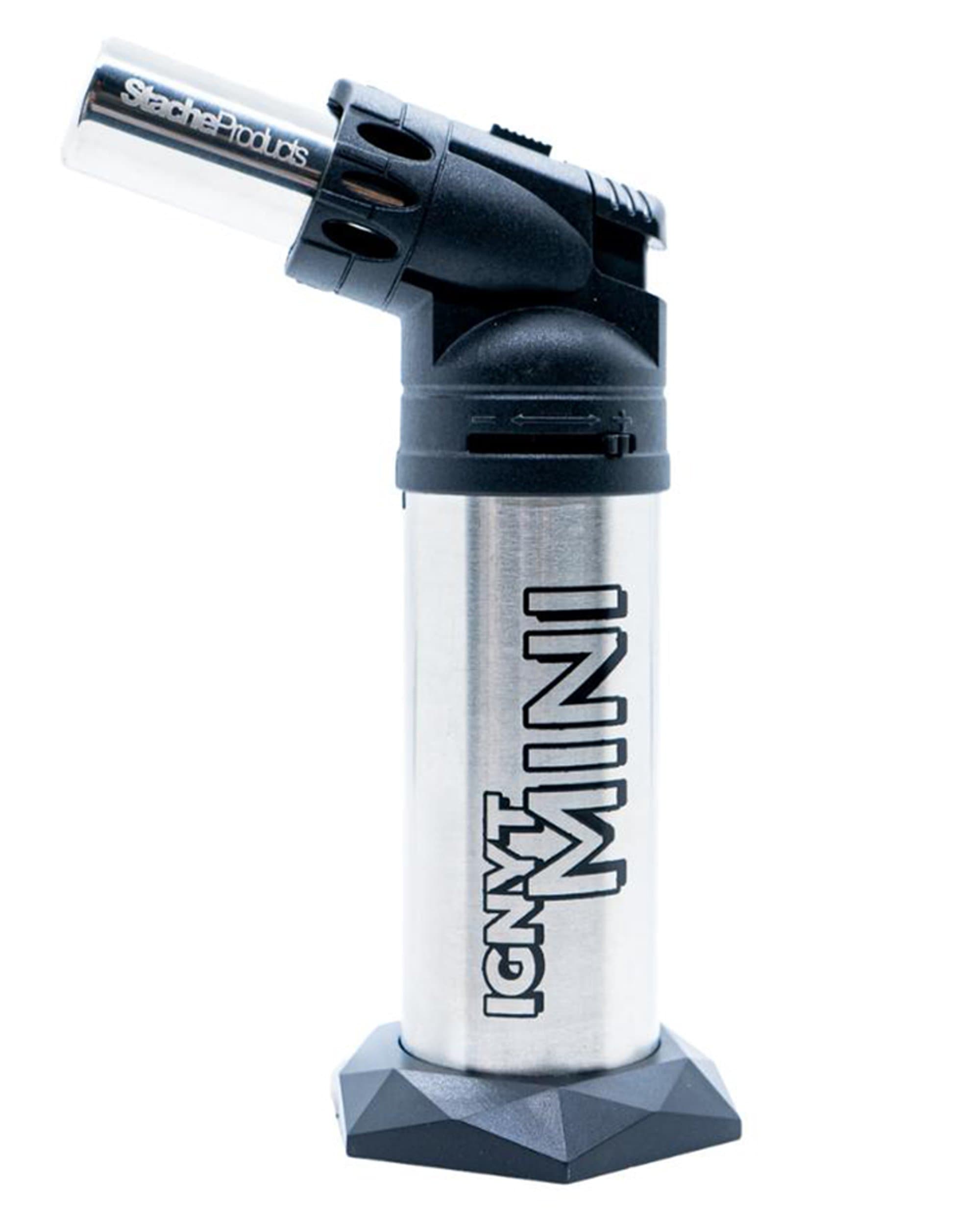 Close-up view of the IGNYT Mini Torch with a black handle and silver burner head. Close-up view of the IGNYT Mini Torch with a black handle and silver burner head.