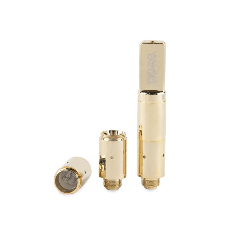 Close-up of the Slim Twist Pro Atomizer, displaying two metallic components against a plain white backdrop. Close-up of the Slim Twist Pro Atomizer, displaying two metallic components against a plain white backdrop.
