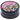 Close overhead view of the DankStop Black Skull Mini Travel Grinder showing a colorful skull-in-sombrero graphic on the black metal lid.