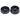 Top-down view of the open DankStop Black Skull Mini Travel Grinder showing two black metal halves with pyramid teeth and a central magnet.